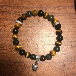 A tiger eye and jade bracelet